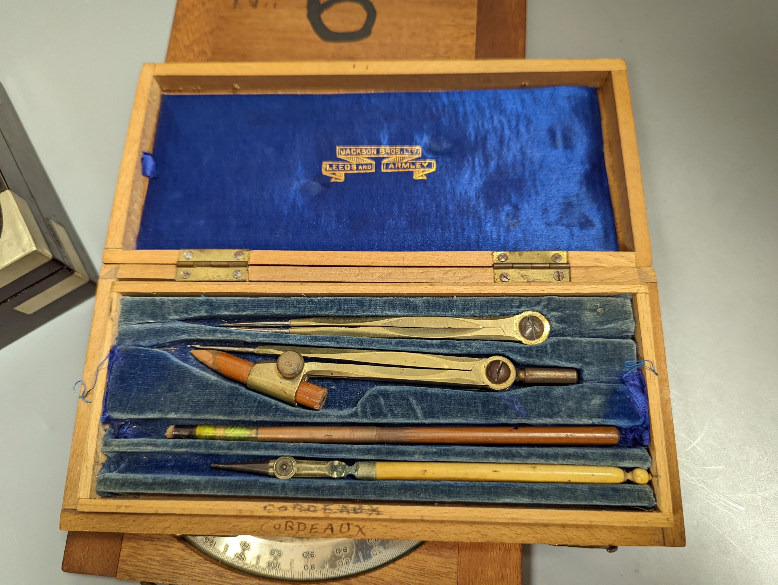 A collection of mahogany cased drawing instruments (8)